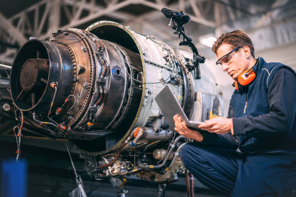 Aircraft Maintenance Engineer Inspect a Turbine Engine